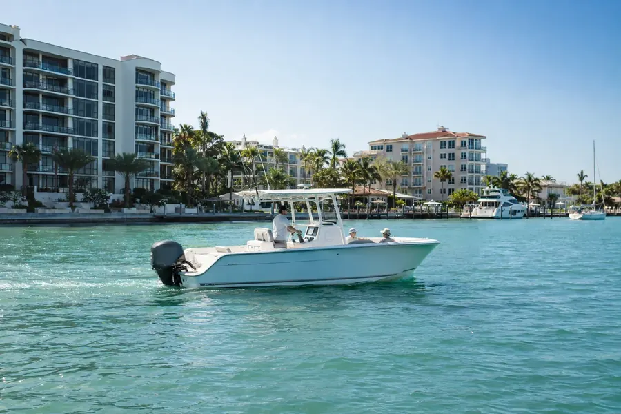 Center-console boat cruising the Intracoastal in Clearwater past waterfront condos and palms