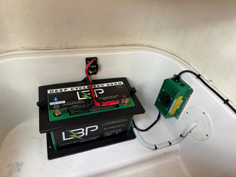 Battery and charger in a console hatch