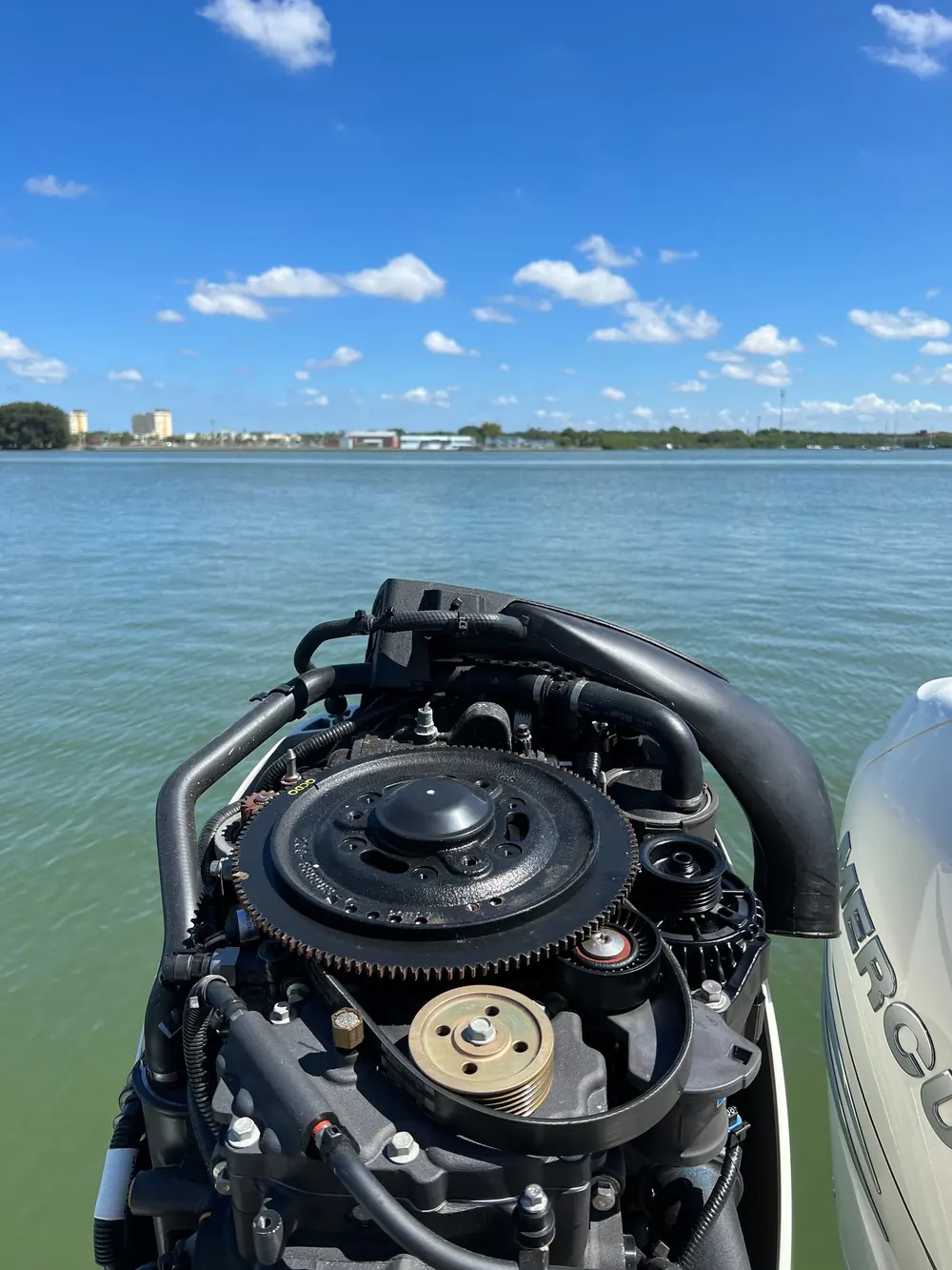 Powerhead work, cowling off, on the water